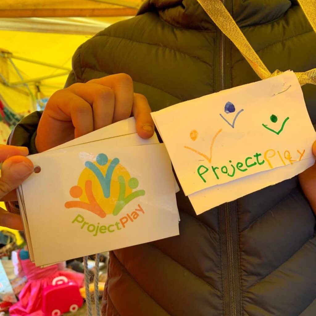 The Project Play logo, with a child’s reproduction. 