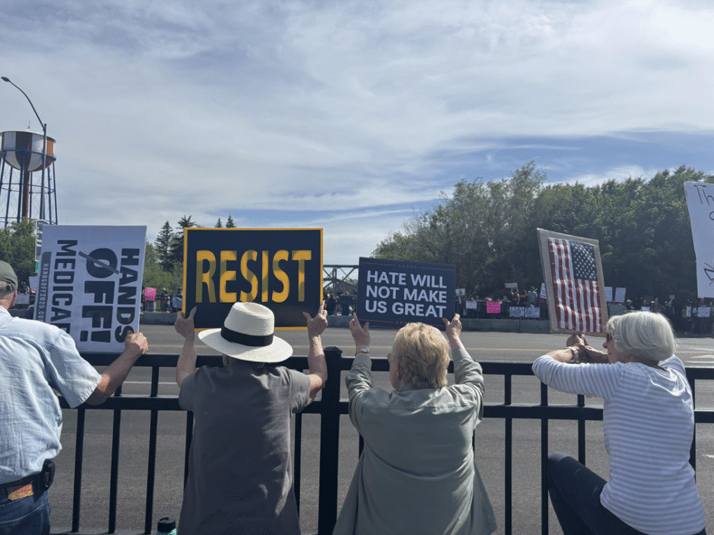 Idaho residents displaying their signs at No Kings Rally by Gracie Leavitt