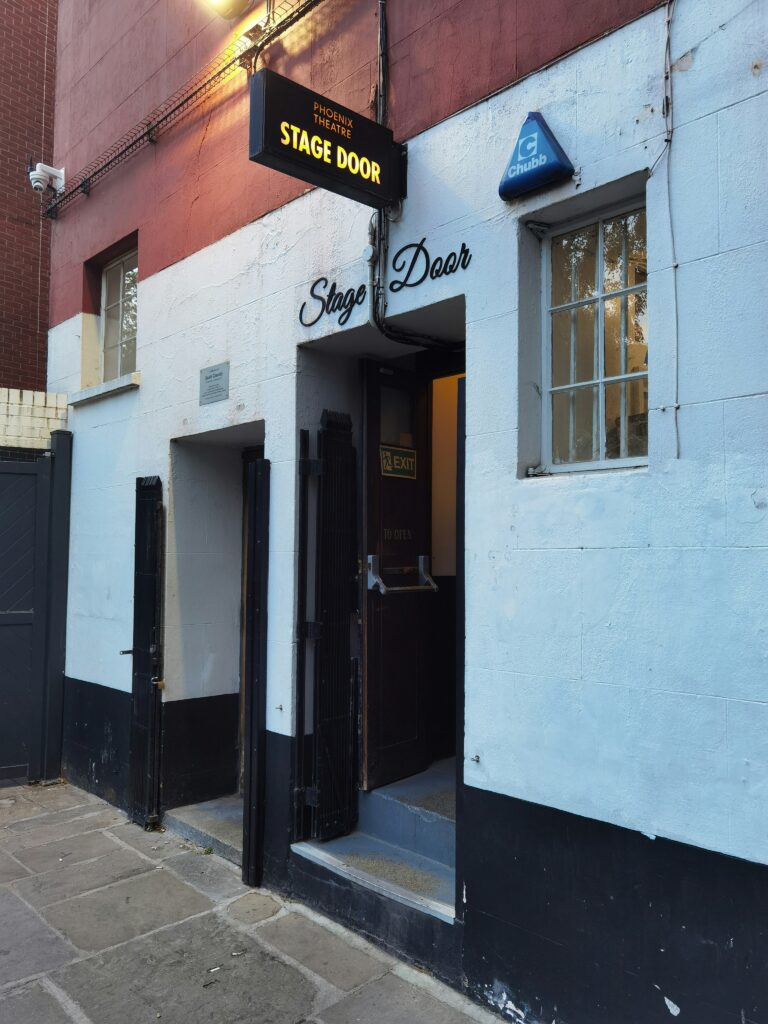 Open stage door, up two steps