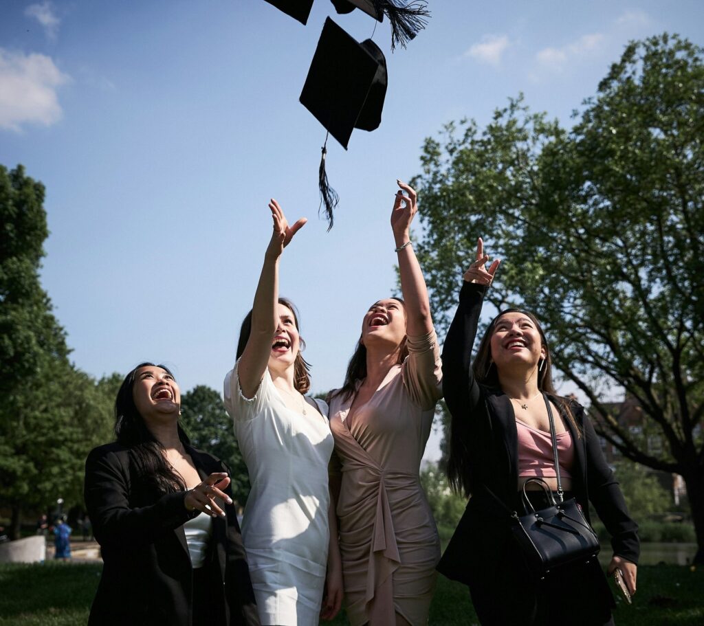 Young students celebrate. Photo by Andrea Buccelli via Unsplash