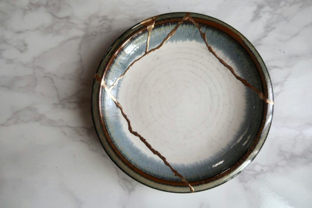 A Kintsugi plate that, once broken, has been repaired with gold lacquer