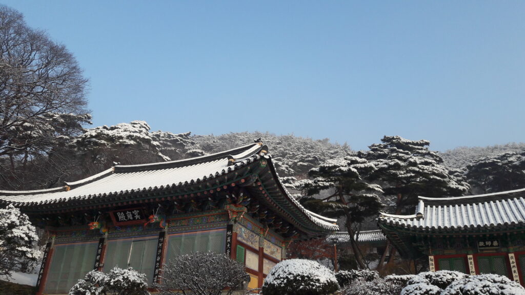 The temple grounds, covered lightly with snow. 