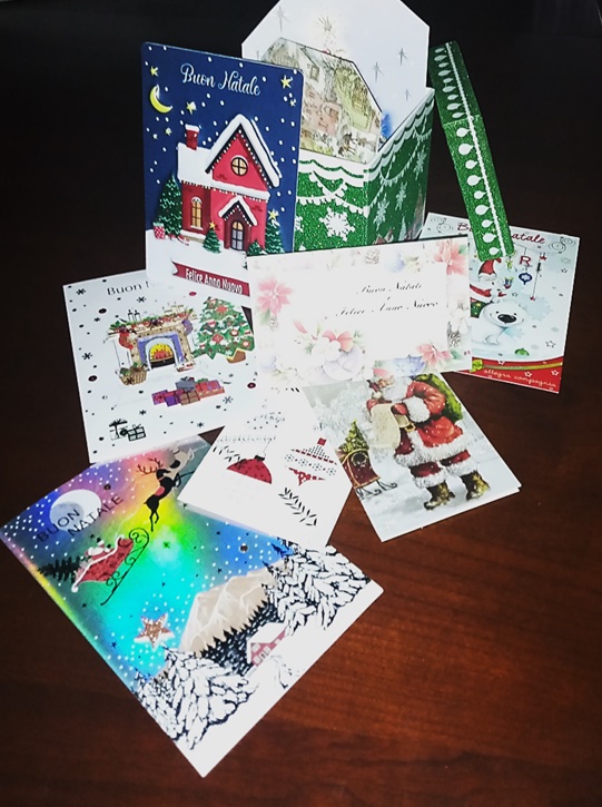 A stack of Christmas cards, featuring various artistic styles.