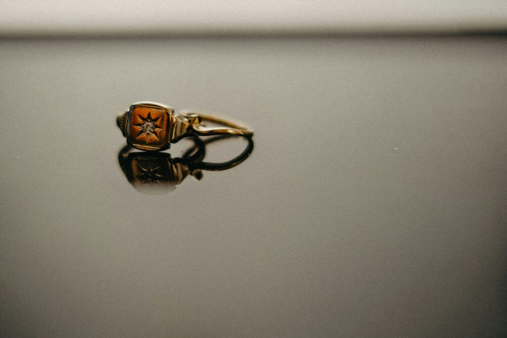 An antique ring with a sun in the center.