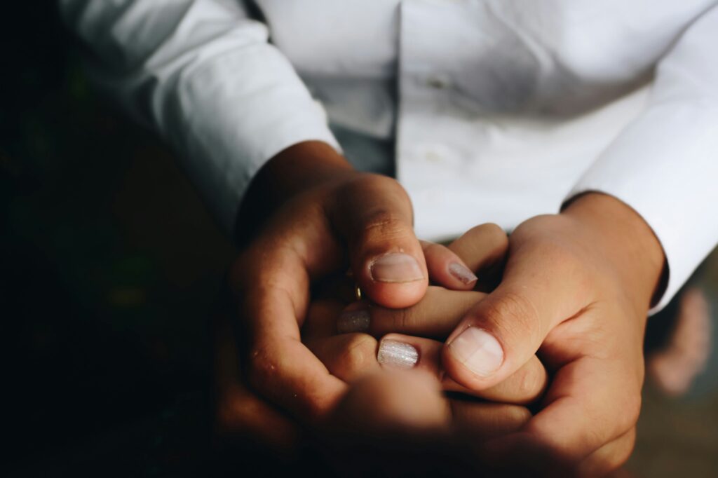 Two people holding hands.