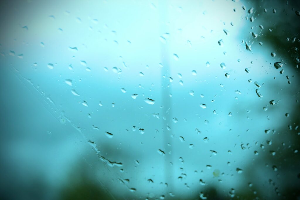 A car window with raindrops on it.