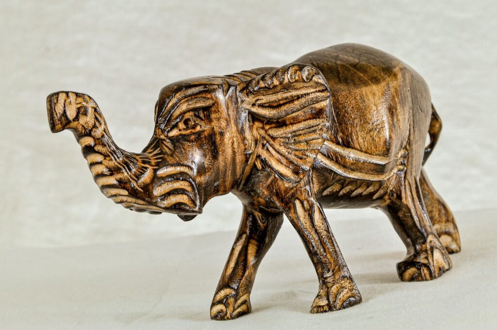 An elephant carved from wood.