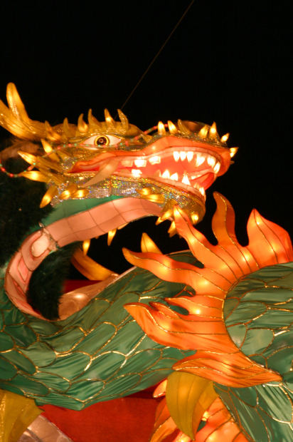 Green & orange paper-mâché dragon that is literally an iconic legend — because literally