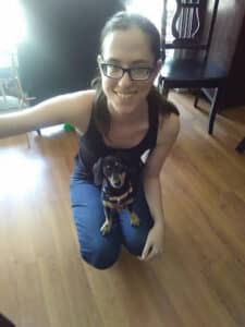 A 13-year-old Sophie Juravle has her new dog, Heidi in her lap after returning home from adopting her.