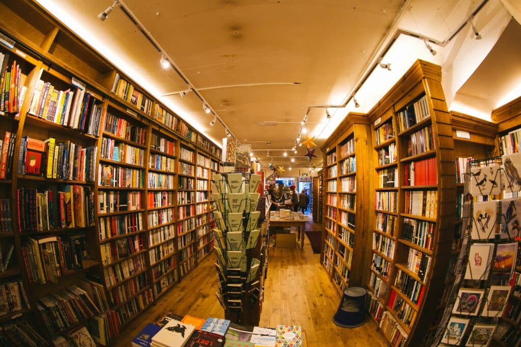 A bookshop, its wares enticingly presented through a curved view, invites the viewer in.
