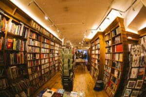 A bookshop, its wares enticingly presented through a curved view, invites the viewer in.