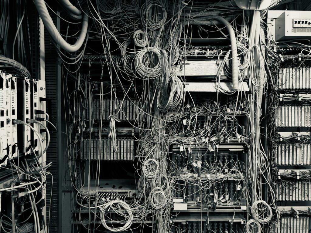 Tangled wires in a server room.