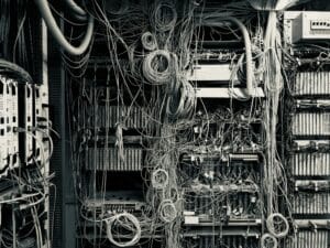Tangled wires in a server room.
