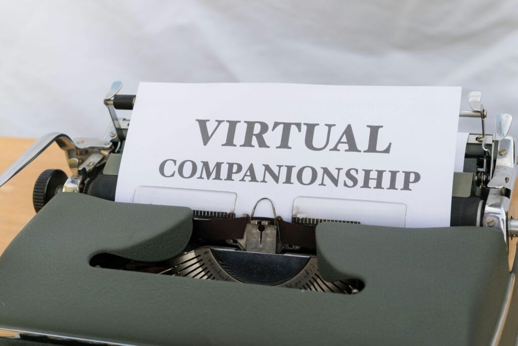 A typewriter with a paper that says virtual companionship.