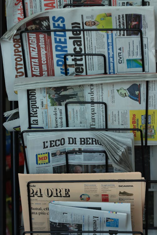 A rack filled with newspapers.