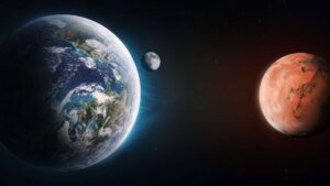 Earth and Mars facing each other in space, with the Moon visible between them, illustrating planetary alignment in the solar system | Photo: Shutterstock