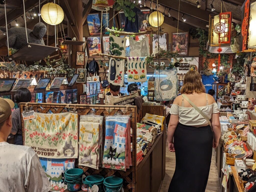 An image of a Japanese gift shop full of Studio Ghibli merchandise and trinkets.