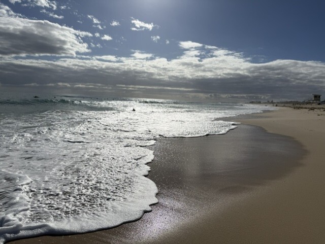 Waves crashing on the shore of Scarborough Beach in Australia.
