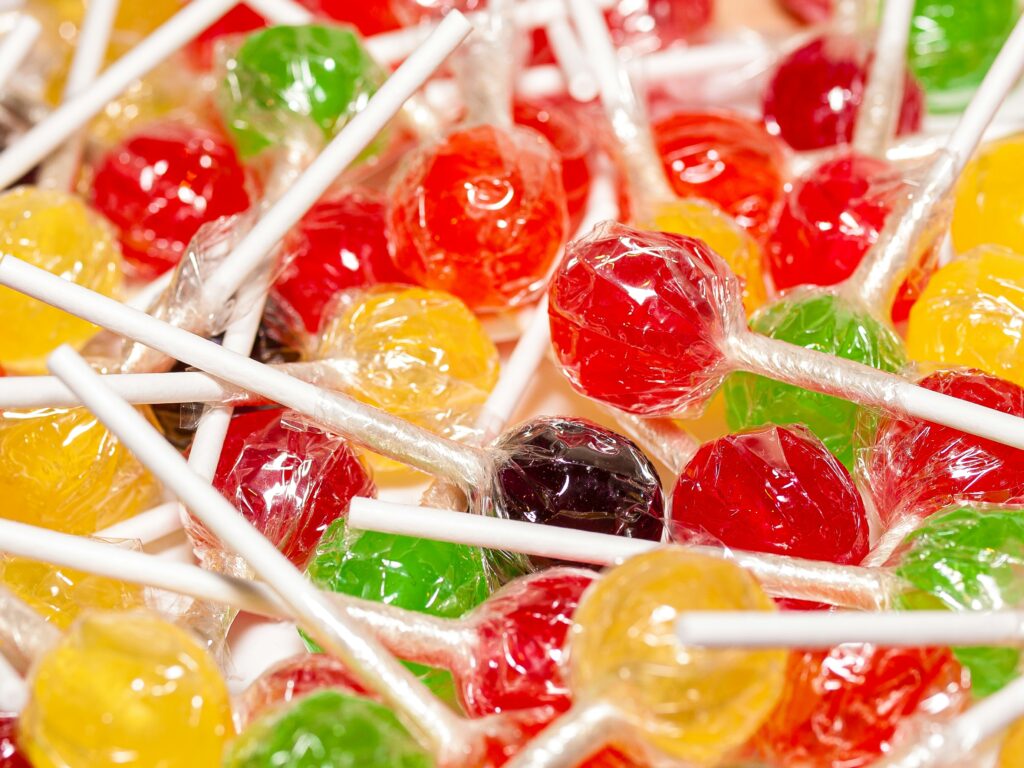 A pile of lollipops still in their wrappers.