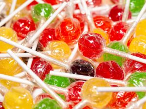 A pile of lollipops still in their wrappers.